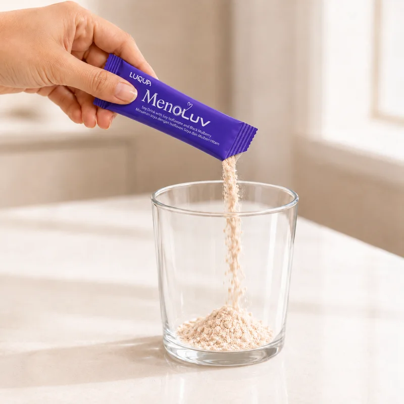 Emptying one MenoLuv sachet into a glass